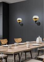 Black and gold mirror wall lamp with Cromina Gold Candellux 21-57242 glass shade